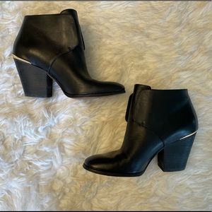 Cole Haan slip on boots with gold detail